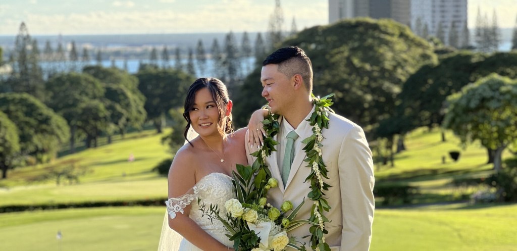 Bride and groom on golf course
